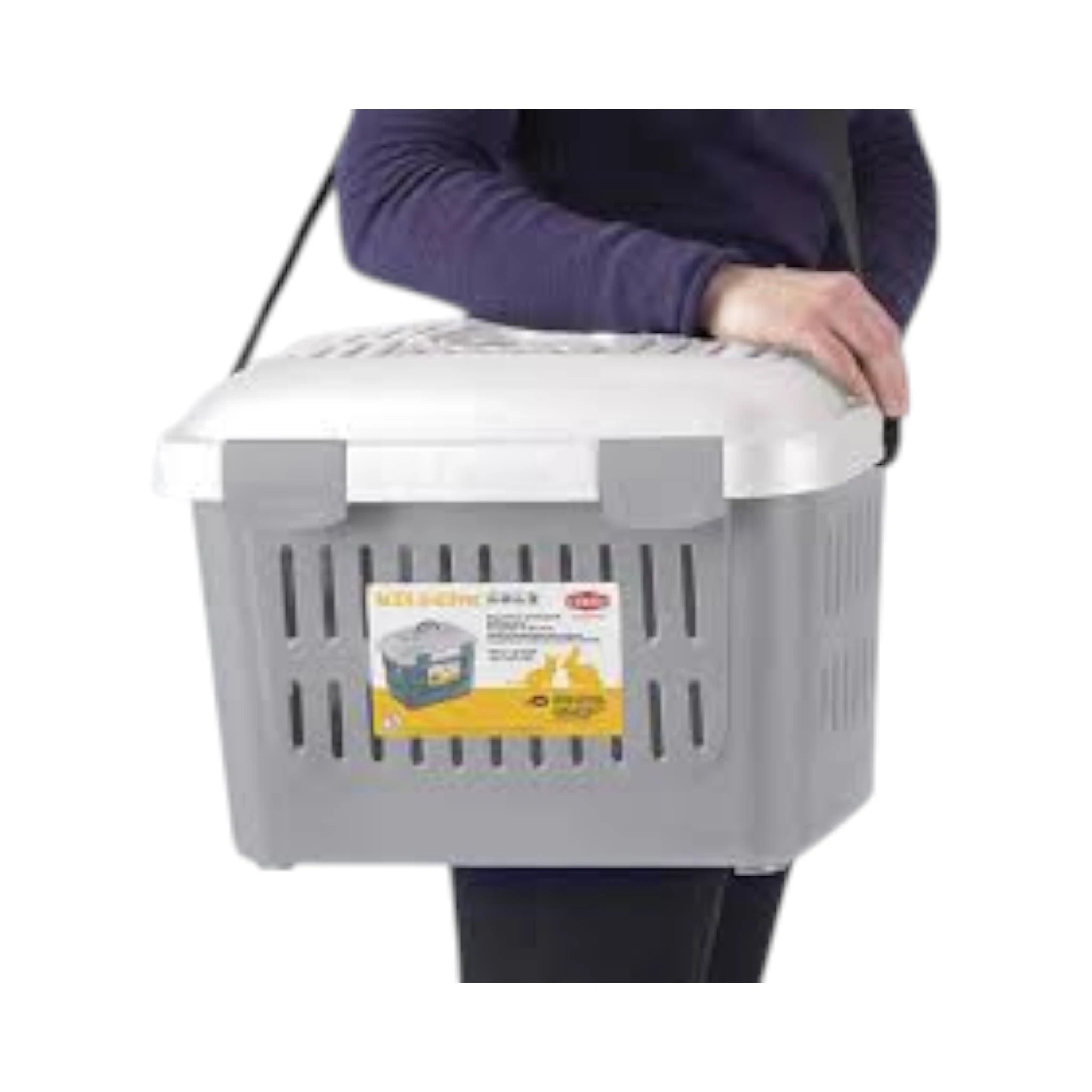 Transportadora MIDI Gulliver Persona cargando transportadora MIDI Gulliver gris con correa ajustable, ideal para transportar mascotas pequeñas.