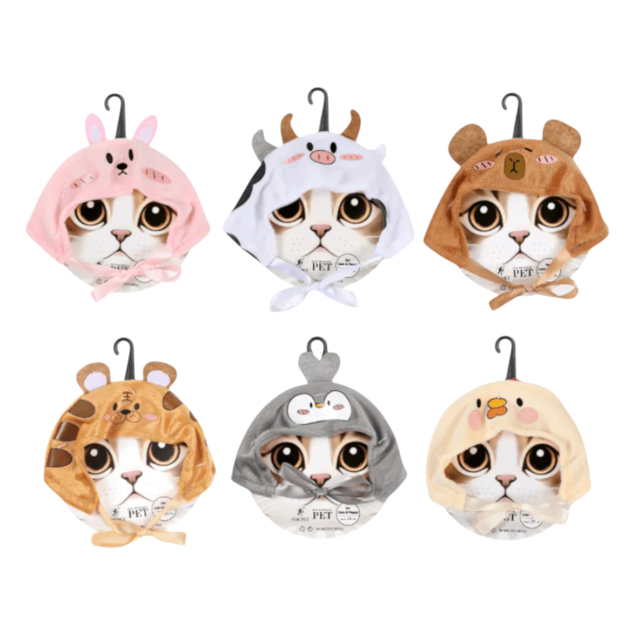 Gorros de animalitos para gatos en diferentes diseños como vaca, conejo, pingüino y oso, unitalla y cómodos para sesiones divertidas.
