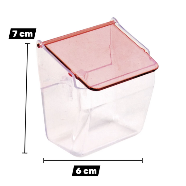 Comedero exterior Pedros transparente con tapa roja y medidas de 7 cm por 6 cm.