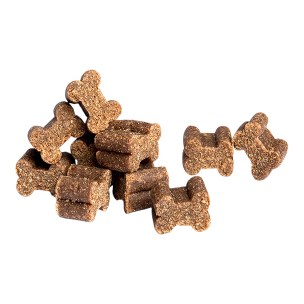 Vista de los pequeños premios Nupec Training con forma de huesito y textura suave, ideales para recompensar a la mascota durante sus rutinas de ejercicio.